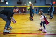 J.T. Williams taught his daughter Clara,then 4 and dressed as Batgirl for a super hero-themed skating party, how to stay balanced on her new skates at
