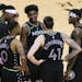 Minnesota Timberwolves forward Anthony Edwards and teammates huddle as time runs down during the fourth quarter of the team’s win over Houston.