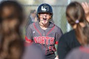 Lakeville North’s Jordan Ahrenstorff (19) celebrates her game-tying home run in the bottom of the seventh inning against Rosemount Wednesday evening