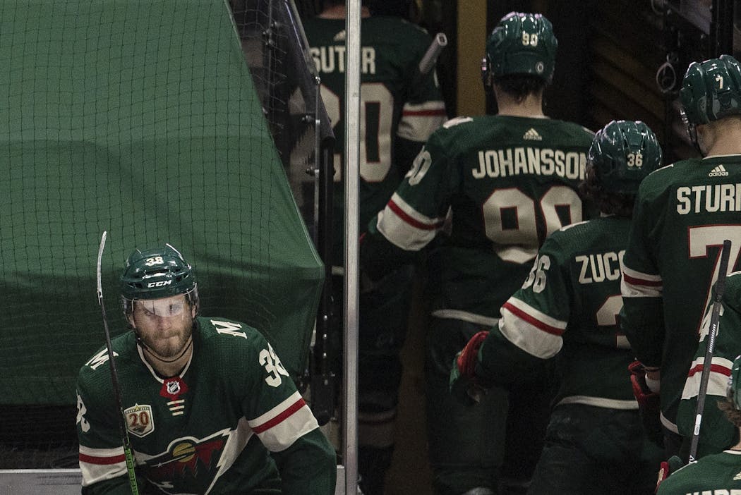 Winger Ryan Hartman, left, lingered on the Wild bench at the end of the game, after the Blues scored three third-period goals to rally for a 4-3 victory.