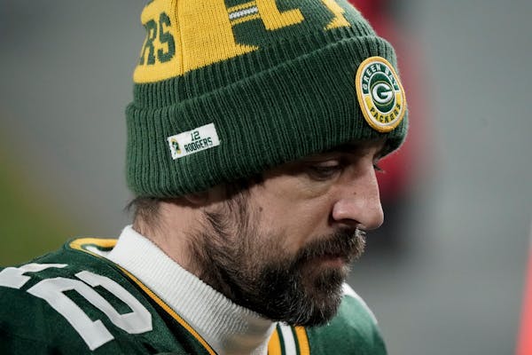 Green Bay Packers quarterback Aaron Rodgers walks off the field after the NFC championship game.
