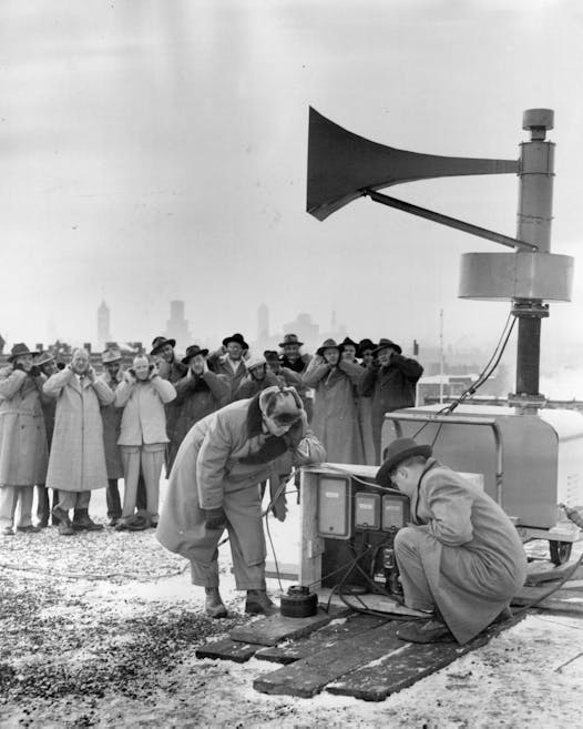 A siren installed atop a fire department building in Southeast Minneapolis is tested in January 1952.