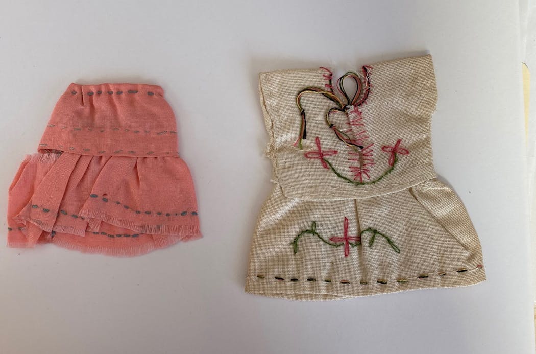 Doll clothes found in a book.