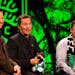 Matthew McConaughey, center, jokes as Dell President and Chief Commercial Officer Marius Haas, left, and Austin FC CEO Anthony Precourt laugh during a