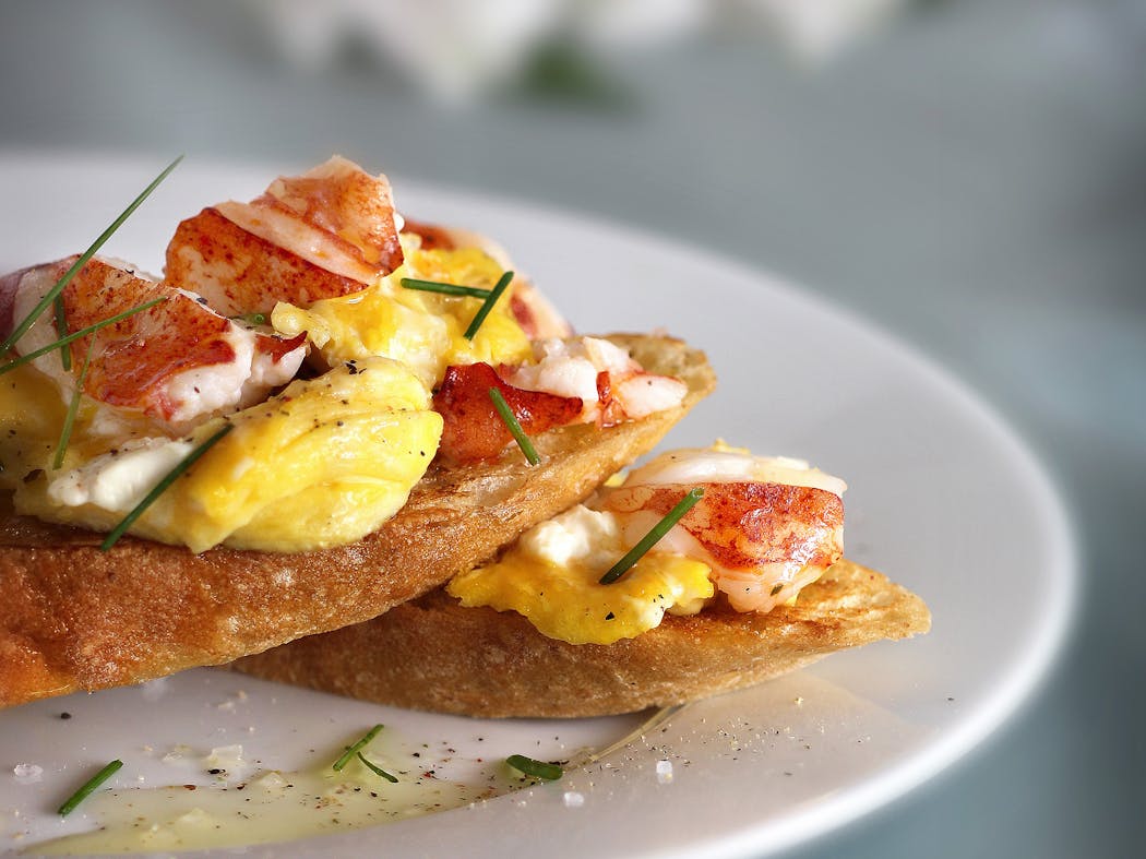 Bruschetta with eggs and lobster.