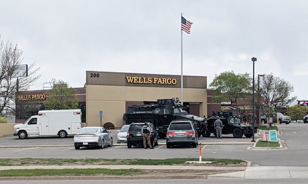 Armored police vehicles were part of the response to the hostage situation at a Wells Fargo bank in St. Cloud on Thursday.