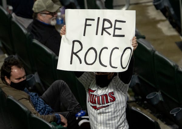 A fan in the stands held up a Fire Rocco sign referring to Minnesota Twins manager Rocco Baldelli in the stands.
