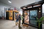 Andy and Sarah Berg showed off their prototypes of a TikiTainer at right, and a home studio, left, at their Latitude Studios showroom and factory floo