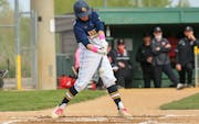 Prior Lake’s Harry Fleek (5) delivers a two-run double in the bottom of the first inning against Belle Plaine Saturday. The Lakers defeated the Tige