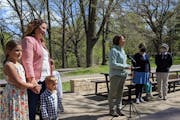 U.S. Sen Amy Klobuchar, at microphone, gathered with several moms on Mother’s Day at Kordiak Park in Columbia Heights to urge people to get COVID-19