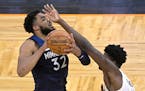 Wolves center Karl-Anthony Towns was fouled by Magic center Mo Bamba during the first half Sunday. Towns has dealt with injuries and personal losses d