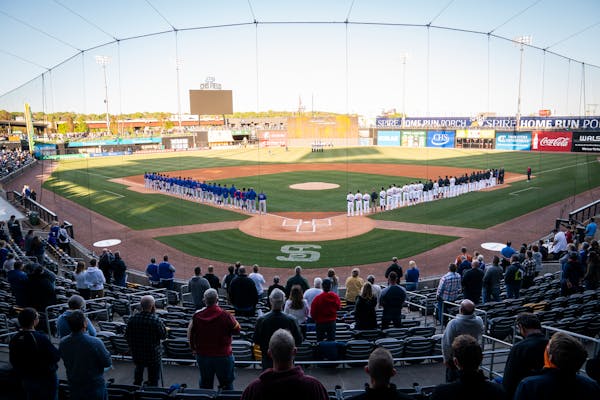 The St. Paul Saints and the Iowa Cubs stood for the National Anthem before the Saints’ 2021 home opener. Diamond Baseball Holdings, which already ow