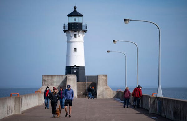 FILE- The federal government is giving away the Duluth Harbor North Pierhead Light — to the right careetaker.