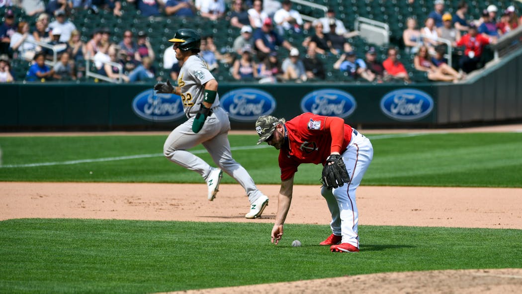 In addition to his ninth-inning error, Josh Donaldson failed to field this ground ball cleanly in the seventh.