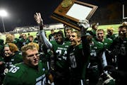 Mounds View players celebrated with their 6A section trophy Friday night after defeating Buffalo.