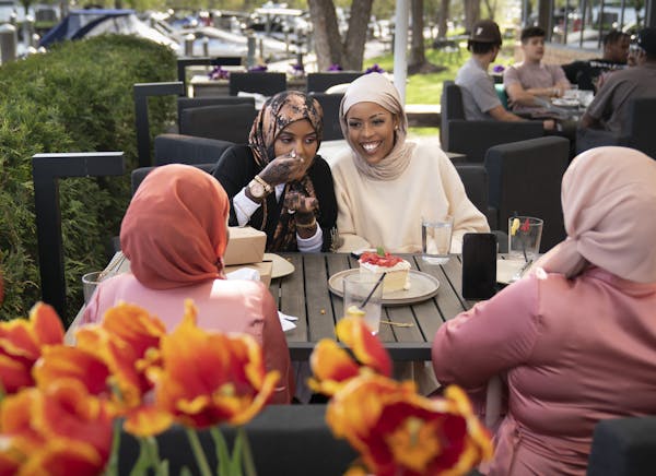 Above: From left, friends Lensa Chaffe, Dumbushe Hussein, Amina Abdul and Fayo Abdulahi met at 6Smith in Wayzata to celebrate Eid with an early dinner