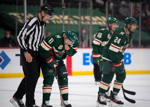 Wild left wing Zach Parise left the ice after being cut by Vegas defenseman Zach Whitecloud in the second period.