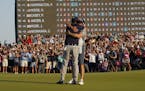 Phil Mickelson, front, celebrates with his caddie and brother Tim after winning the PGA Championship Sunday in Kiawah Island, S.C.