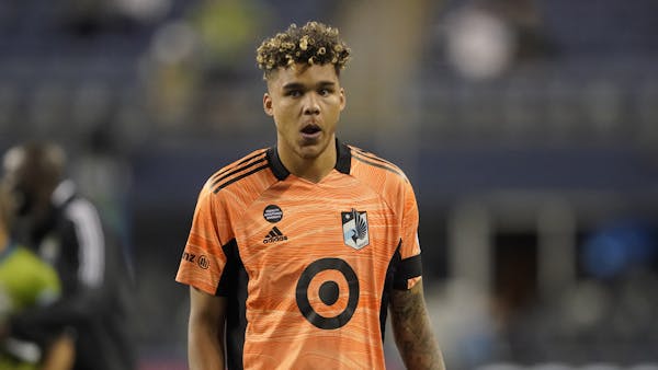 Goalkeeper Dayne St. Clair is among Minnesota United’s Black players who continue to raise their fists during the national anthem in the name of rac