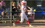 Benilde-St. Margaret’s Sophie Melsness belts a solo home run against St. Anthony Tuesday evening. Melsness scored all three of the Red Knights’ ru