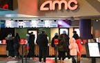 Patrons lined up at an AMC theater in New York. The company over the weekend shuttered its theater in Maple Grove. 