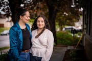 Lucia Morelos Quintero posed for a portrait with her sister Cristina, left, outside their South St. Paul home.
