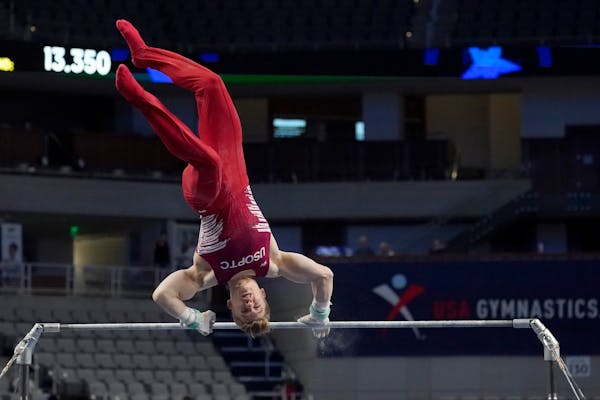 Shane Wiskus took the first of three falls while competing in the high bar during the U.S. Gymnastics championships Saturday night in Fort Worth, Texa