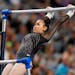Suni Lee competes on the uneven bars during the U.S. Gymnastics Championships on Sunday, 