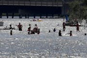 Swimmers flocked to Lake Nokomis has the heat soared in the Twin Cities last July. Water-related incidents claimed three lives and left one seriously 