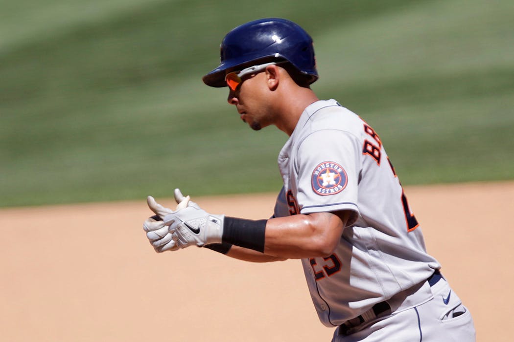 The Astros’ Michael Brantley gave thumbs up after hitting a two-RBI single in the seventh inning Sunday. Brantley finished with four hits and four RBI in Houston’s 14-3 thrashing of the Twins at Target Field.