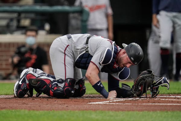 Mitch Garver reacts after a foul ball hit him in the groin on June 1 in Baltimore. He hasn’t played since.