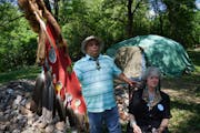 Tommy Tomahawk, tribal relations, and Mendota Mdewakanton Dakota Tribal Community chairperson Sharon Lennartson sat in the shade in front of a sweat l