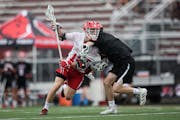 Jackson Leischow of Benilde St. Margaret’s leans into a defender as he brings the ball up the field in a boys state tournament semifinal. Benilde be