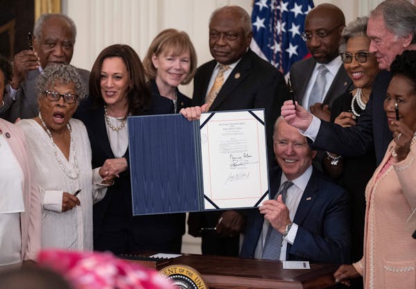 Biden signs law making Juneteenth a federal holiday