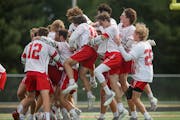 Benilde-St. Margaret’s players celebrate their 16-6 victory over Prior Lake in the boys’ lacrosse state championship game at Stillwater. Boys’ l