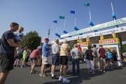 People line up at the main ticket booth on the first day of the 2016 Minnesota State Fair.  [Leila Navidi/Star Tribune] • leila.navidi@startribune.c