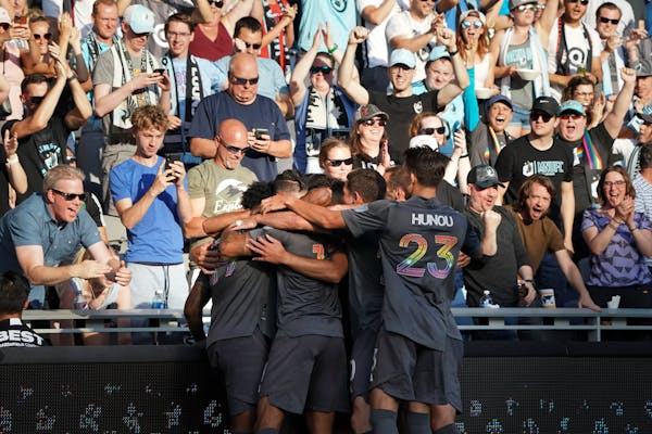Teammates celebrated with Minnesota United forward Franco Fragapane (7) after he scored in the first half.