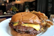 Rick Nelson • Star Tribune  The burger at Sidebar at Surdyk’s in Minneapolis.