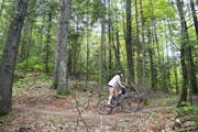 Alexandera Houchin rode her bike through the Pine Valley trail system near Cloquet, Minn., one of her favorite spots to ride when she isn’t training