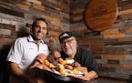 Famous Dave’s CEO Jeff Crivello, left, and founder Dave Anderson in a 2019 photo. The company was sold Tuesday to MTY Food Group, a Canadian franchi