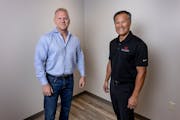 Mike Bernier and Long Doan of Realty Group showed their new and soon-to-be-furnished office in Woodbury.