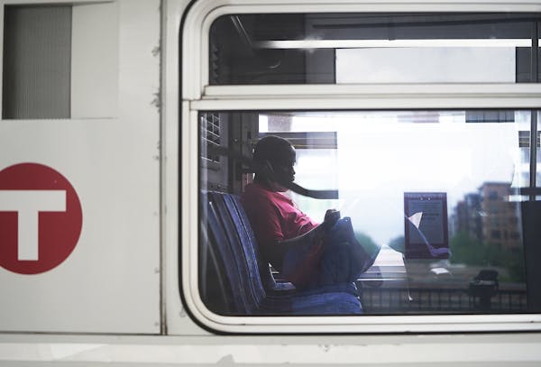 A commuter sits on a Metro Transit Bus outside the Hennepin Ave and Uptown Station Monday in Minneapolis on Monday, May 24.       ]  DAVID JOLES • d
