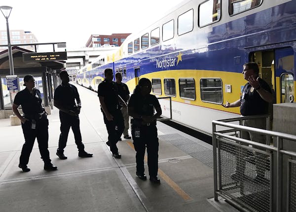 Metro Transit police officer Richard Gizzi spoke to trainees outside the Northstar Line last week. Metro Transit is hiring and taking other steps to e