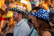 Audience members wear beer-patterned cowboy hats while waiting for Darius Rucker to perform at Mystic Lake Casino in Prior Lake Friday, June 18, 2021.