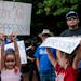 People protest against critical race theory being taught in schools at a rally in Leesburg, Va., on June 12.