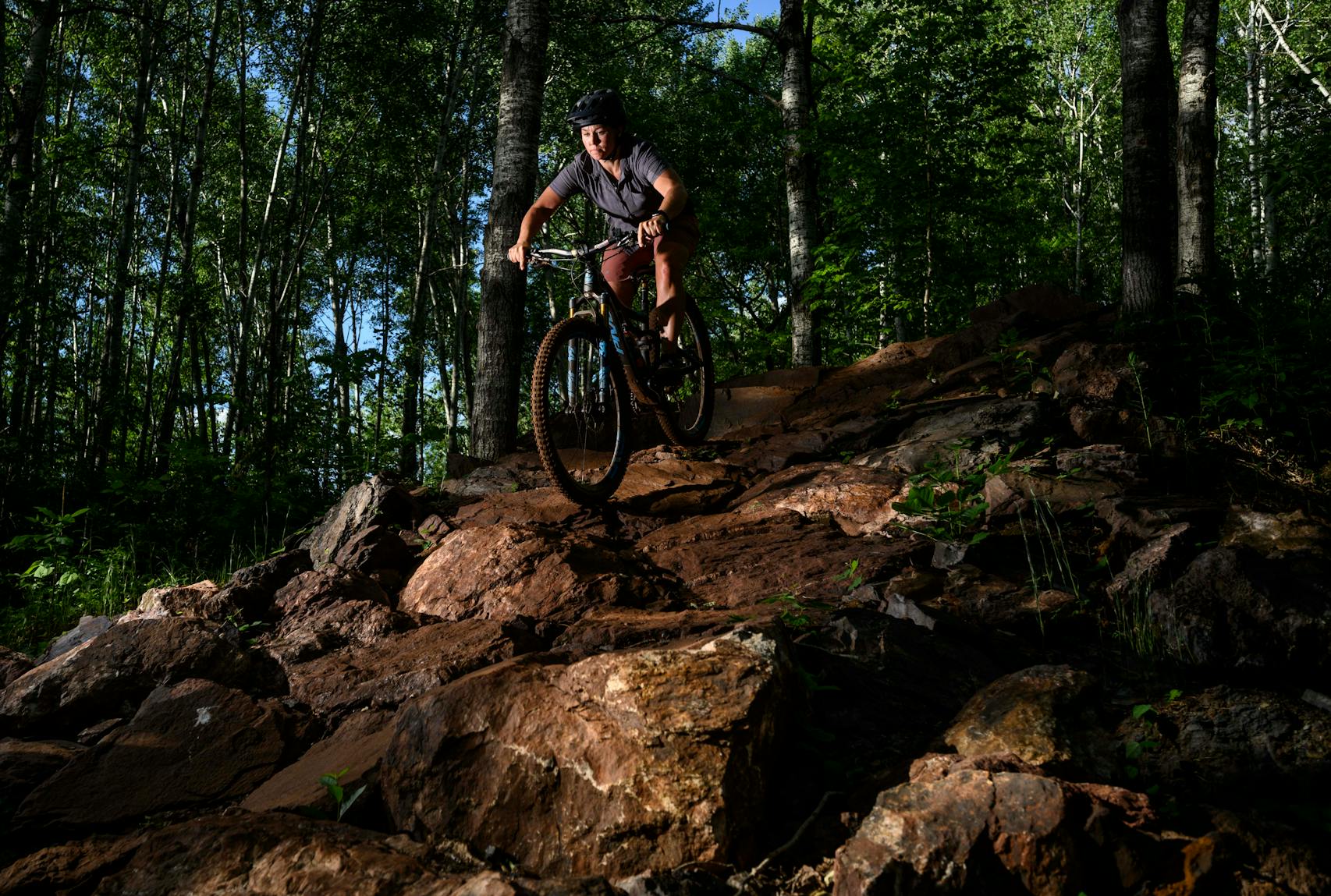Mari Kivisto navigated a rock wall on the Drawpoint Trail as night came to the Cuyuna Country State Recreation Area. 