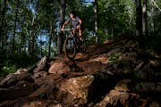 Mari Kivisto navigated a rock wall on the Drawpoint Trail as night came to the Cuyuna Country State Recreation Area. “Mountain biking gave me a comm