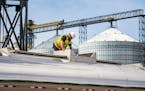 An employee worked atop a vat of industrial ethanol at Al-Corn Clean Fuel ethanol plant in Claremont, Minn. 