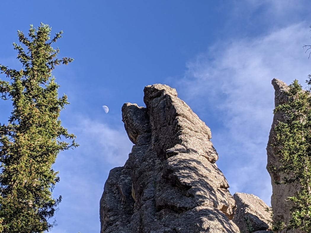 The rugged granite spires of the Needles Highway can be seen near Sylvan Lake Lodge. Photo by Simon Peter Groebner.
