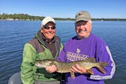 Veteran guide and former bait shop owner Marv Koep, left, with Mike Arms, a retired Catholic priest. The two are longtime fishing friends.
